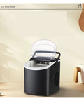 Hella Fast Portable Countertop Ice Maker Drops Fresh Cubes In Six Minutes With Sturdy Carry Handle Self Cleaning Tech Pushes Out Twenty Six Pounds Daily Anytime on a kitchen counter.