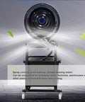 Heavy Duty 300W Industrial Drum Fan With Wide Oscillating Sweep And Rugged Caster Wheels To Blast Kickin Fresh Air And Atomized Water Misting Across Large Workshops, showcasing misting spray in action.