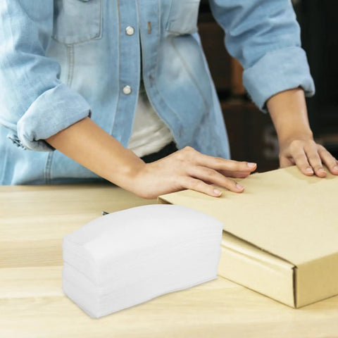 Stack of EPE Foam Sheets And Protection Bags Pack Soft White Wrap Ready To Ship for Electronics Valuables on table with person packing box