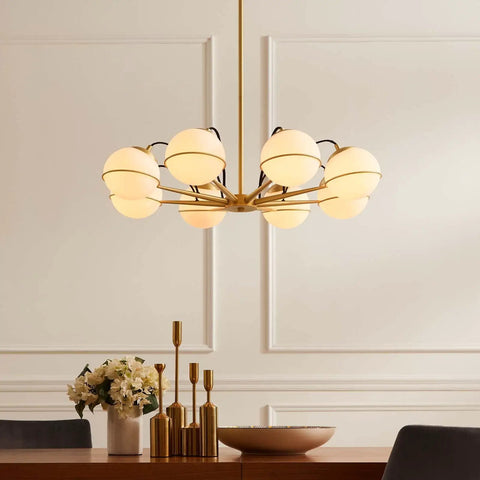 Opal Gold 8-light chandelier with dimmable glow above dining table; satin brass frame, E26 base, modern chic showpiece lighting.