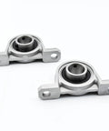Four Piece Zinc Alloy Pillow Block Bearings 20mm Bore For Heavy Machinery Smooth Rotational Movement Features Secure Locking And Self Aligning Capability Helps Machines Run Smooth As Silk For Any Project Work Needed Soon, 20mm bore pillow block bearings
