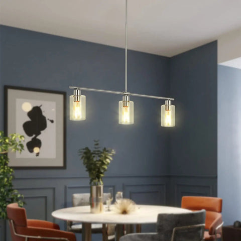 Three Light Modern Chandeliers For Kitchen Island Lighting In Brushed Nickel With Clear Glass Pendants over round dining table