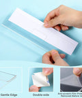 Hands holding clear acrylic wall name plate holder with adhesive, shown with double sided foam tape for office use, size 2x8 inches.