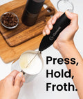 Handheld Milk Frother Wand With Stand, Turbo Electric Coffee Mixer For Frothy Cappuccinos And Lattes in use foaming milk