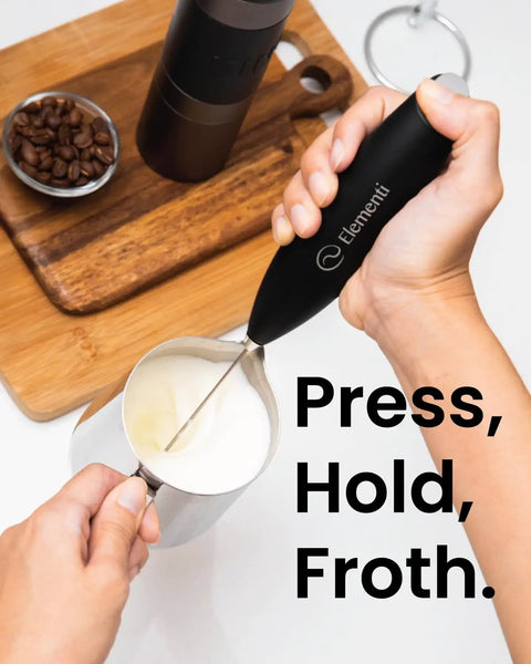 Using a Handheld Drink Mixer With High Speed High Torque Motor Electric Stirrer And Protein Powder Wand Mini Frother For Quick Cocktails Milk Frother And Coffee Stirrers In Black Easy To Use Silky Foam In Seconds in a kitchen.