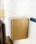 Line And Point Laser Level With 65 Ft Range, Two Bubble Vials, Batteries Included, And Versatile Mount For Easy Setup used on wall