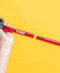 TKC 9-inch perforated pizza peel side view with red aluminum handle and threaded connector