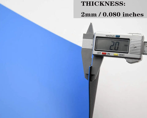 Caliper measuring thickness of blue ESD mat, showing 2mm, part of High Temperature ESD Mat Kit With Wrist Strap And Ground Cord For Electronics.
