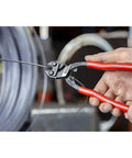 Person using CoBolt Compact Bolt Cutter With Notched Blade, 10-Inch Heavy Duty Wire Cutter for bolts, nails, rivets.