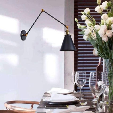 Adjustable Swing Arm Wall Sconce In Matte Metal With E27 Socket Built As A Knockout Go To Nightstand Reading Lamp Featuring A Swivel Pivot Bar, elegant black and gold design in dining setting.