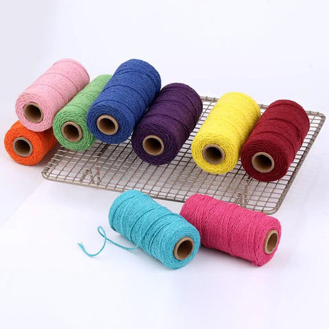Colorful spools of Macrame Cord 1.5mm Cotton String Rope for DIY Crafts 109 Yards With 35 Color Options on a wire rack