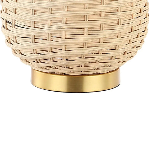 Close-up of light brown rattan texture with brass base on the Brass Gold And Light Brown Rattan LED Table Lamp With White Linen Shade, 25 Inches Tall, Perfect Coastal Vibe For Living Room Or Bedroom, Bulb Included.
