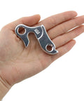Person holding one piece of Two Pack Aluminum Alloy Rear Derailleur Hangers For Mountain And Road Bikes Go-To Universal Transmission Rack Guard