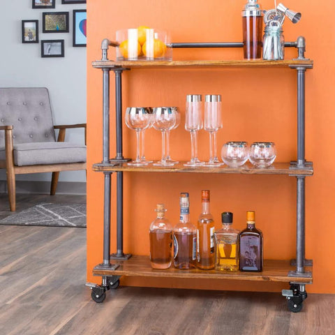 Wooden shelf on swivel caster wheels for three quarter inch pipe, showcasing bottles and glasses, highlighting mobility and tool-free assembly.