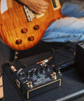 Close-up of Guitar Amp Pedal With 9 Amp Models And Dual Channel For 18 Tones IR Cab Sim XLR Out FX Loop And True Bypass on studio amp