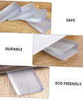 Three stackable furniture leveling shims on wood surface, showing clear, durable PVC material for stabilizing couches and chairs.