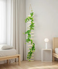 Extra Tall Six Foot Wooden Ladder Plant Trellis for indoor use supporting climbing vines in modern bedroom setting