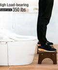 Person standing on Wooden Toilet Stool For Kids And Adults, Anti Slip Bamboo Potty Training Step Stool, 7 Inch, testing 350 lb capacity