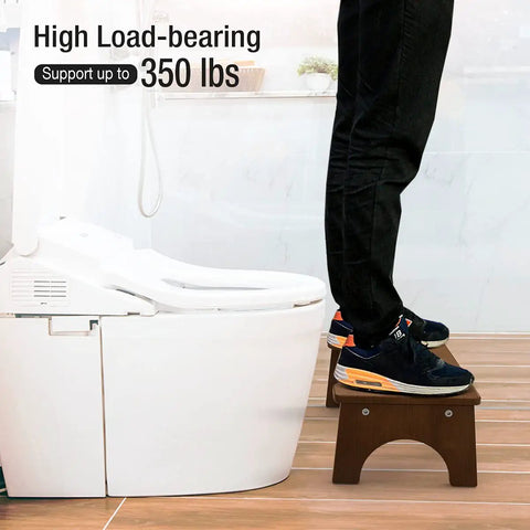 Person standing on Wooden Toilet Stool For Kids And Adults, Anti Slip Bamboo Potty Training Step Stool, 7 Inch, testing 350 lb capacity