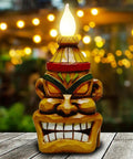 Outdoor Solar Tiki Head Statue With Dancing Flame Glow For Garden Yard Patio Tiki Bar Style Torch Light Figurine on wooden table