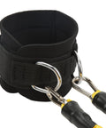 Close-up of black ankle strap with D-ring cuffs for resistance training, glute building bands for kickbacks and hip workouts.