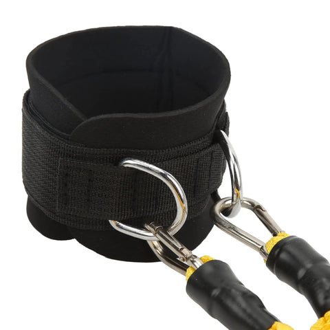 Close-up of black ankle strap with D-ring cuffs for resistance training, glute building bands for kickbacks and hip workouts.