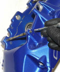 Close-up of a Slick Brake Caliper Pad Pin Punch for Easily Sliding Out Stuck Bolts on Most OEM Brembo setups in use.