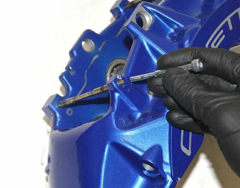 Close-up of a Slick Brake Caliper Pad Pin Punch for Easily Sliding Out Stuck Bolts on Most OEM Brembo setups in use.