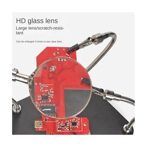 Handy Soldering Helping Hands With Alligator Clip Magnifier for PCB Board Repairs showing magnifying lens on red circuit board