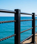 Top Shelf 1/8 Black T316 Stainless Steel Cable Railing 1200 Ft With Cable Cutter Hella Tough Marine Grade 7X7 Wire Rope on a pier.