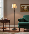 Sophia LED Floor Lamp Tall Mid Century Modern Style With Bell Shape Fabric Shade Bronze Finish For Bedroom And Living Room Decor Ideal Standing Light For Cozy Home Vibe in a cozy living room corner beside an armchair and side table.