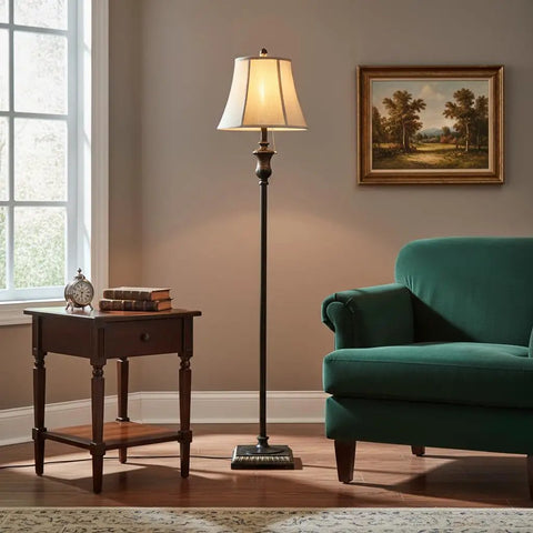 Sophia LED Floor Lamp Tall Mid Century Modern Style With Bell Shape Fabric Shade Bronze Finish For Bedroom And Living Room Decor Ideal Standing Light For Cozy Home Vibe in a cozy living room corner beside an armchair and side table.