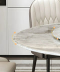 Close-up of Top Shelf Faux Marble Round Dining Table With Effortless Spin Lazy Susan Turntable Solid Black Metal Pedestal Base.
