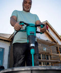 Man using Universal Large Mixing Paddles For Drill Mixers MKD Series Double Mud Mixer with HEXAFIX outdoors.