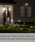 Slick Solar Pathlight Featuring Motion Activated 80 Lumen Bright Led Bulbs guiding family at nighttime into the house.