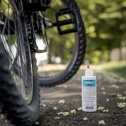 Pro Grade Heavy Duty Multi Use Liquid High Performance Industrial Lubricant For Minimum Quantity Lubrication MQL, 4 oz bottle near bicycle