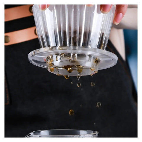 Straight Fire Premium Glass Pour Over Coffee Dripper Boasts Crystal Eye Viewing Window in use with coffee dripping through.