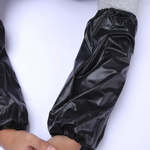 Heavy Duty Waterproof Pvc Oversleeves 6 Pack Set Oilproof Arm Covers For Mechanics And Diy Daily Grind Grease Monkey Ready Reusable Sleeve Guards For Home And Workshop, black PVC arm covers on forearms.