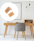 Slick Glide Furniture Slider Pads Two Hundred Pack For Hardwood Floors shown on a modern desk to protect against scratches.