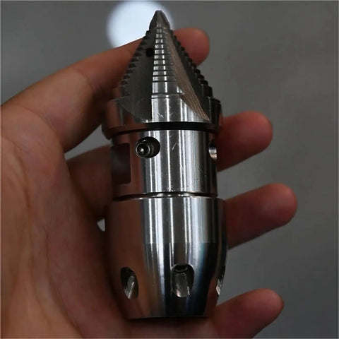 Person holding anti corrosion rotating nozzle for high pressure water jet pipe cleaning tough clog buster accessory for sewer machines