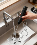 Person rinsing Dope Rechargeable Handheld Milk Frother Wand, with 3 Speed Settings, 3 Stainless Steel Whisks, and Stand in a kitchen sink