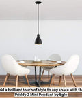 Priddy 1-Light Mini Pendant With Steel Shade Black And Gold For Kitchen Island Hallway And Dining Room hanging over a modern dining table