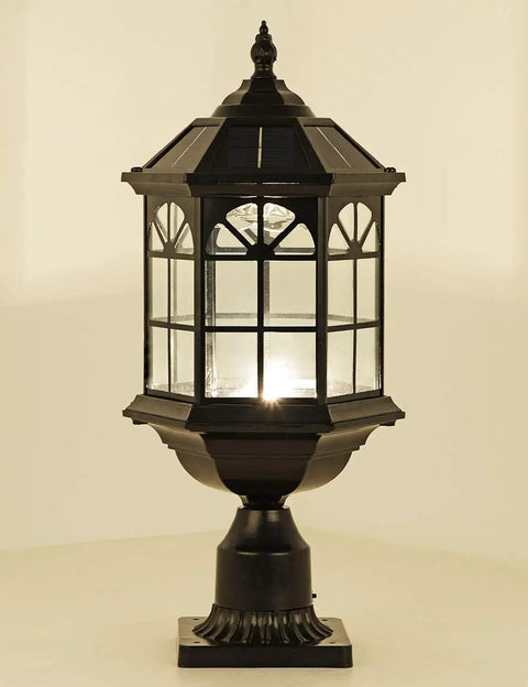 Solar Post Light Fixture For Outdoor Gardens And Patios With Vintage Die Cast Aluminum In Oil Rubbed Black And Clear Glass, Weather Resistant Pier Lamp, LED Warm White Or Cool White, No Fuss Install And Hardwired Ready showing a lit LED light and detailed glass design.