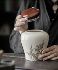 Top Tier Ceramic Loose Tea Storage Jar With Secure Lid perfect for keeping coffee beans, spices, nuts, and candy, showing lid being placed.