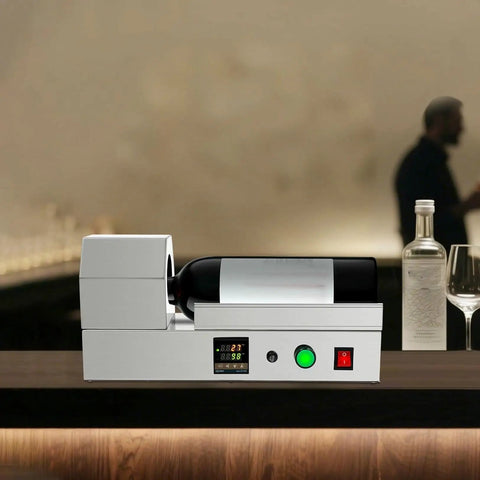 Electric PVC Wine Bottle Capsule Heat Shrinker, Tabletop Label Sealing Machine with digital display and wine bottle in use.