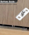 Rock Solid Aluminum Sliding Door Track Set With 18 Ft Buttery Smooth Glide Hardware For Barn Doors And Laundry Rooms Featuring Dead Silent Zinc Alloy Wheels And Sleek Champagne Finish bottom guide preventing door wobbling, close-up on surface.
