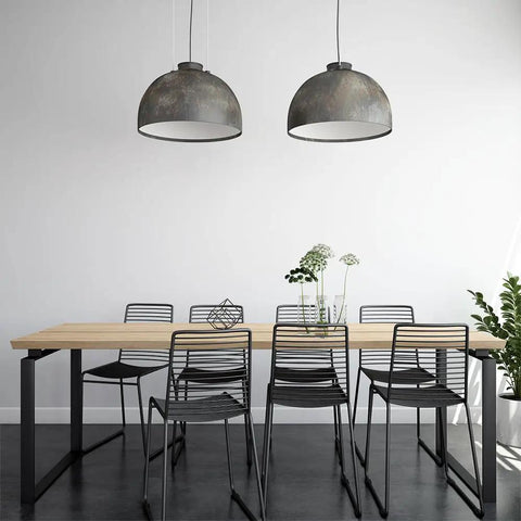 Modern dining room with black chairs, wooden table, and metal pendant lights, featuring White Peel And Stick Contact Paper on walls.