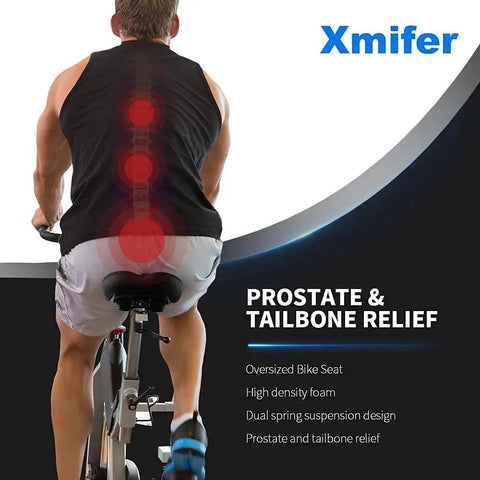 Man riding exercise bike with oversized comfy bike seat with extra padding and memory foam for men and women universal replacement bicycle saddle waterproof leather blue tailbone relief