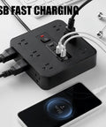 16 In 1 Smart Power Strip Surge Protector With 12 AC Outlets And Dual USB C Ports, charging mobile devices with clean desk setup.