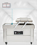 Heavy Duty Double Chamber Vacuum Sealer with stainless steel finish, designed for sealing meat, seafood, and veggies.